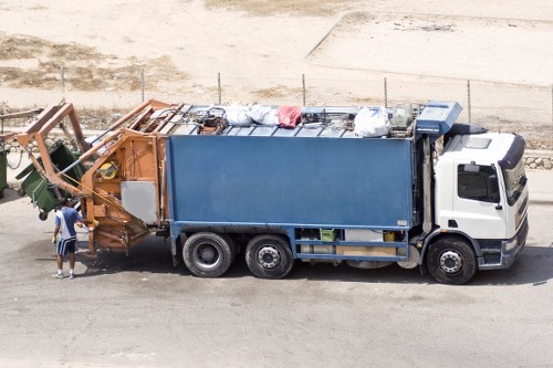 Crew lifting bulky kitchen equipment during a restaurant clearance near Maida Vale